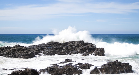 Waves crashing over rocks at the coast