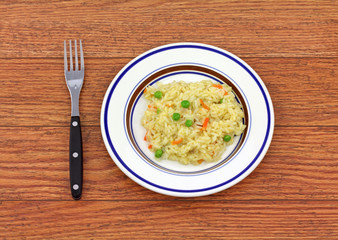 Serving of rice pilaf on small plate