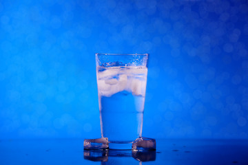 glass of water of defocused lights