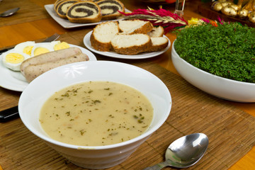 Traditional white borsch soup with eggs and sausages