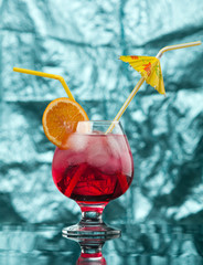 red coctail drink with ice cubs
