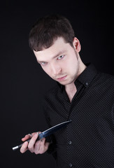 Anger man with knife look from dark