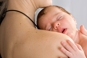 picture of  mother with slepping baby over white