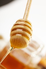 Honey with wood stick