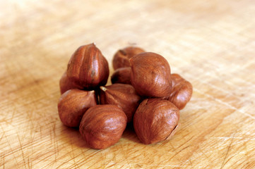 hazelnuts on wooden background