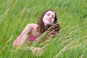 Young pretty girl on grass