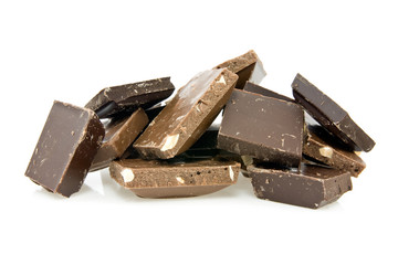 milk and dark chocolate pieces on white background