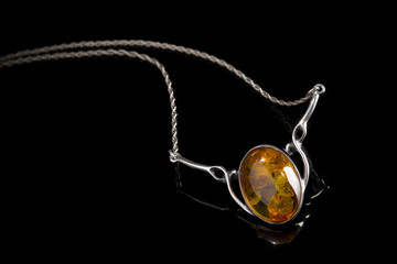 amber pendant on silver necklace