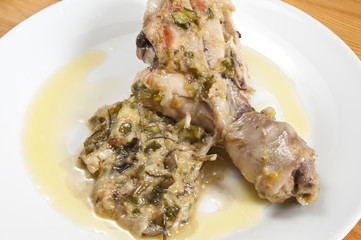 chicken in a pan with onions and zucchini