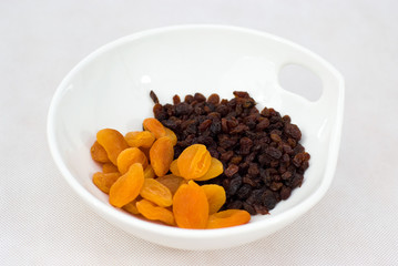 mix dryed fruits on white  bowl