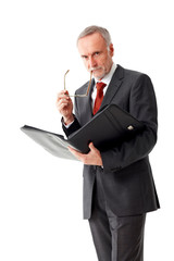 Tough senior business man with folder, isolated