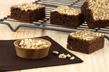 chocolate brownies with cracked peanuts on top