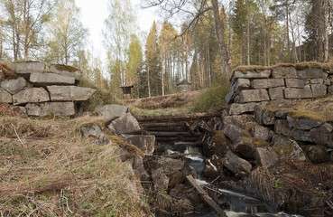 Creek running through wooden damming