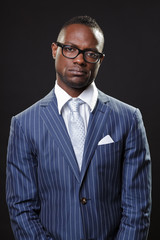 Serious business man wearing suit and glasses. Isolated.