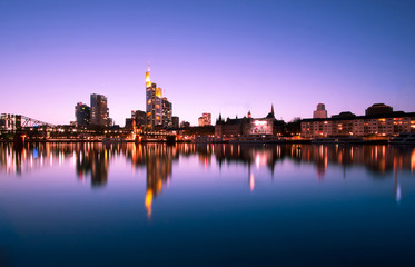 Fototapeta na wymiar Night view on the Frankfurt skyline with reflections on water