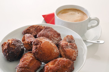 traditional spanish fritters and a white coffee