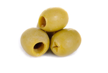 Some green pitted olives isolated on the white background