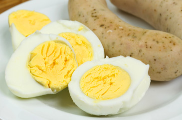 Eggs and white sausages breakfast