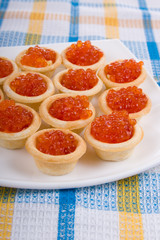 Tartlets with red caviar