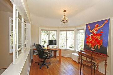 Home office with bright windows