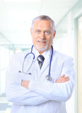 Closeup portrait of a happy senior doctor with stethoscope