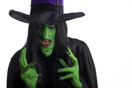 Evil witch looking to attack. White background.