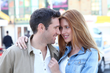 Happy couple doing shopping in town