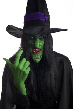 A scary witch, signaling come here. White background.