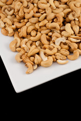 Salted Cashews on White Plate