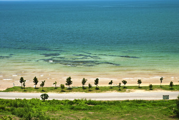 Sand beach ,sea and blue sky