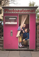 boy and girl in photo booth