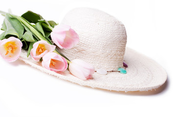 white straw summer hat with flowers tulips