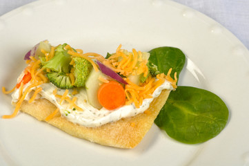 Fresh veggie pizza on a plate