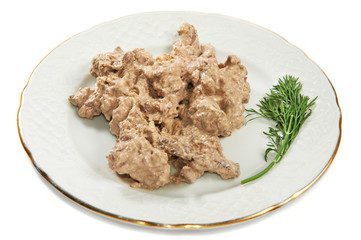 Beef liver baked in sauce with fennel on plate
