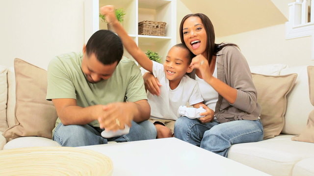 African-American Family Playing on Games Console