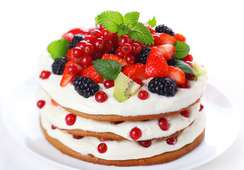 cake with fresh berries isolated on white background