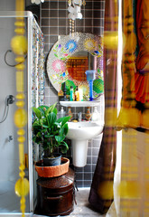 modern bathroom with mosaic tiles on wall