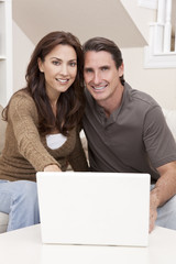 Man & Woman Couple Using Laptop Computer At Home