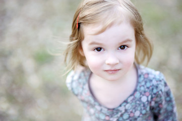 Adorable happy toddler girl smiling outdoors