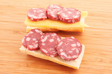 Sandwiches with sausage, cheese and bread