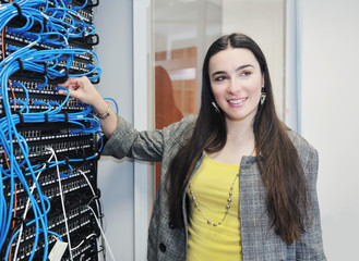 woman it engineer in network server room