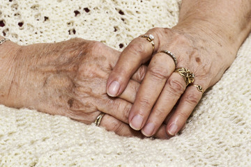 Senior woman's crossed hands
