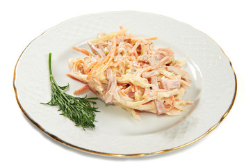 Salad with ham, carrot, cabbage and onions on plate