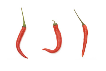 Three red Thai chili peppers