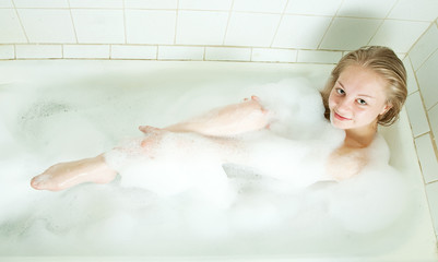 girl enjoys in the bathtub