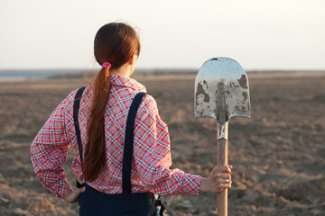 farmer   in plowed field