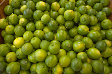 Limes bunched together on a local farm stand