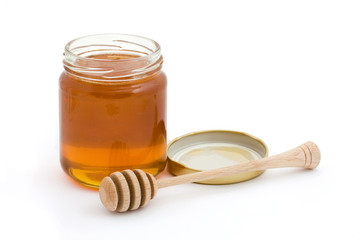 Jar of open honey with drizzler