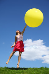 Fototapeta na wymiar woman uncurl and flies upwards on inflatabe balloon