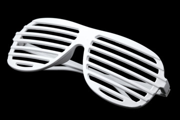 white striped plastic sunglasses isolated on black